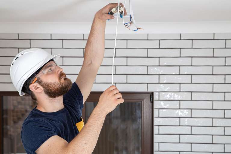 electrician-builder-at-work-installation-of-lamps